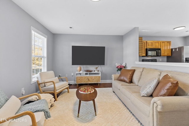 living room with light hardwood / wood-style floors