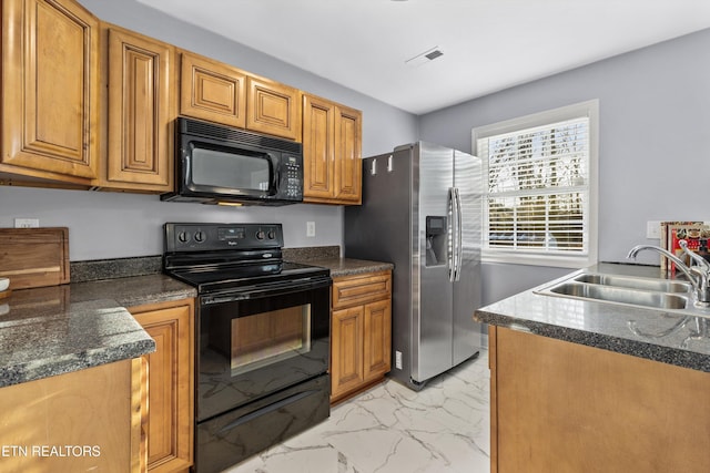 kitchen featuring black appliances and sink