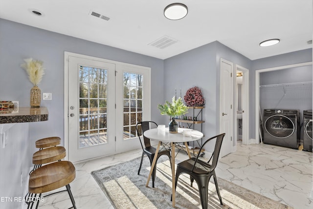 dining room with washing machine and clothes dryer