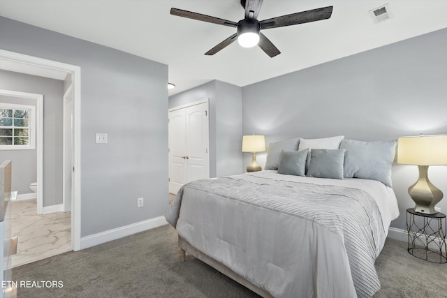 carpeted bedroom featuring a closet and ceiling fan