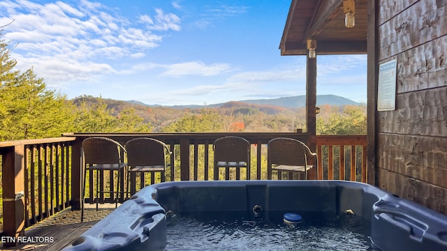 wooden terrace featuring a mountain view