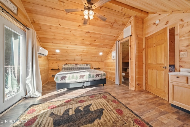 bedroom with wood walls, ceiling fan, hardwood / wood-style flooring, and a wall mounted air conditioner