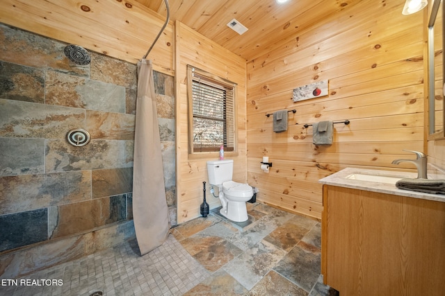 bathroom with a shower with shower curtain, toilet, wood walls, vanity, and wood ceiling