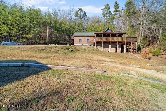 view of yard featuring a wooden deck