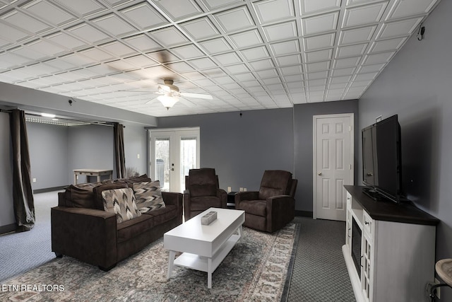 living room with carpet flooring, ceiling fan, and french doors