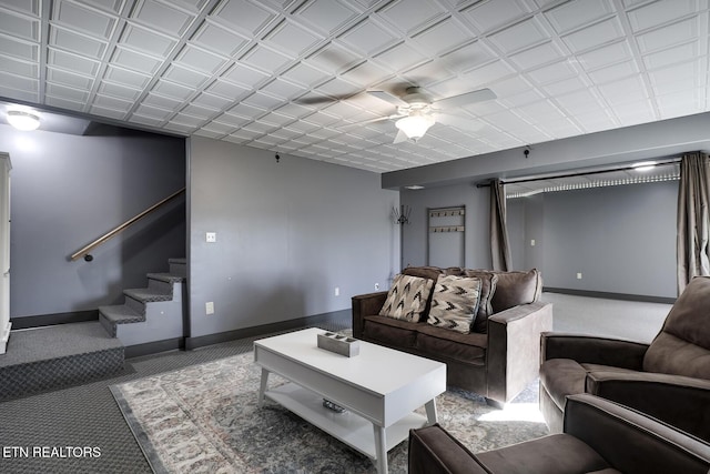 carpeted living room with ceiling fan