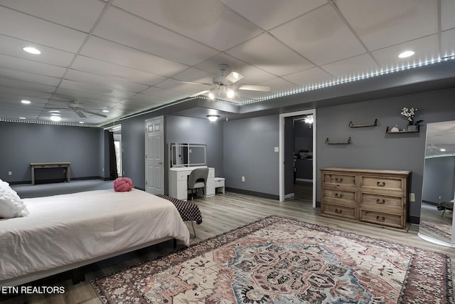 bedroom featuring ceiling fan and light hardwood / wood-style flooring