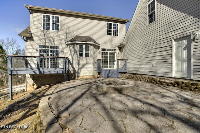 back of house with a patio area