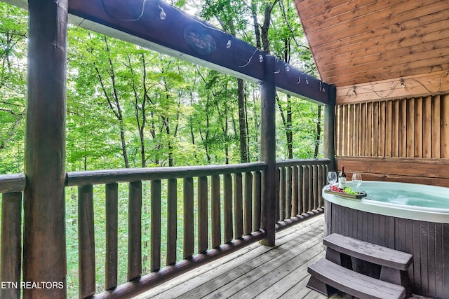 deck featuring a hot tub