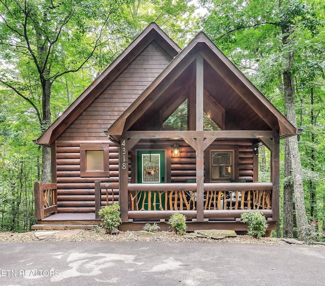 cabin with covered porch