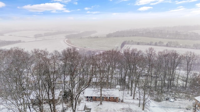 snowy aerial view with a rural view