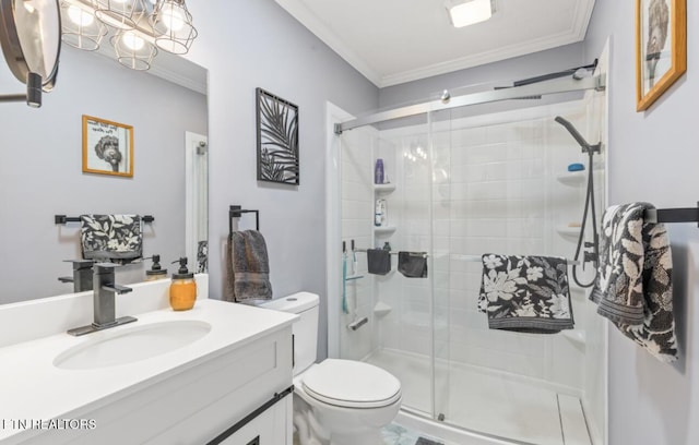 bathroom featuring toilet, ornamental molding, walk in shower, and vanity