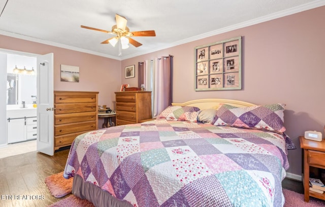 bedroom featuring ceiling fan, ornamental molding, hardwood / wood-style floors, and ensuite bath