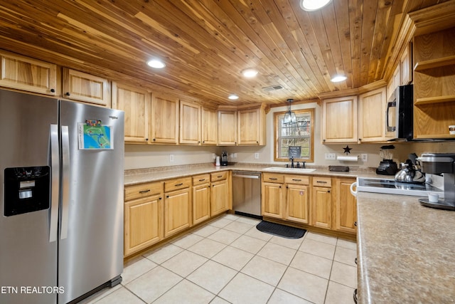 kitchen featuring sink, stainless steel appliances, light tile patterned flooring, and pendant lighting