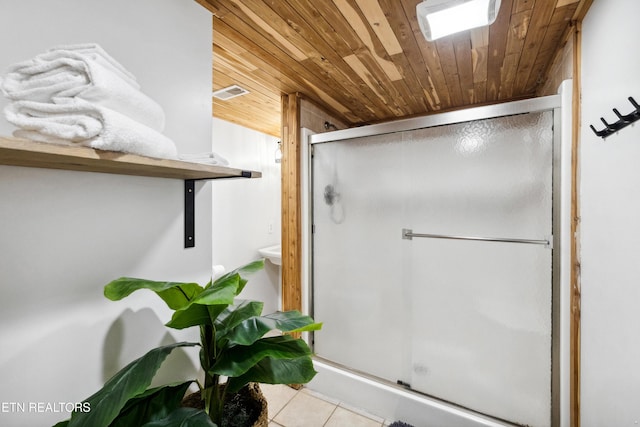 bathroom featuring wooden ceiling, an enclosed shower, and tile patterned floors