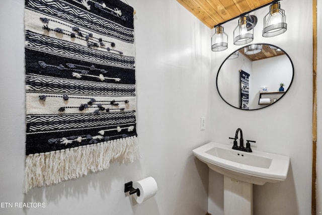 bathroom featuring sink and wooden ceiling