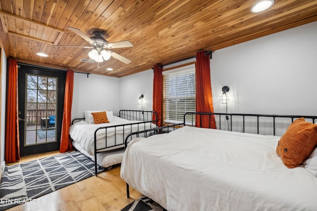 bedroom with ceiling fan, light hardwood / wood-style flooring, wood ceiling, and multiple windows