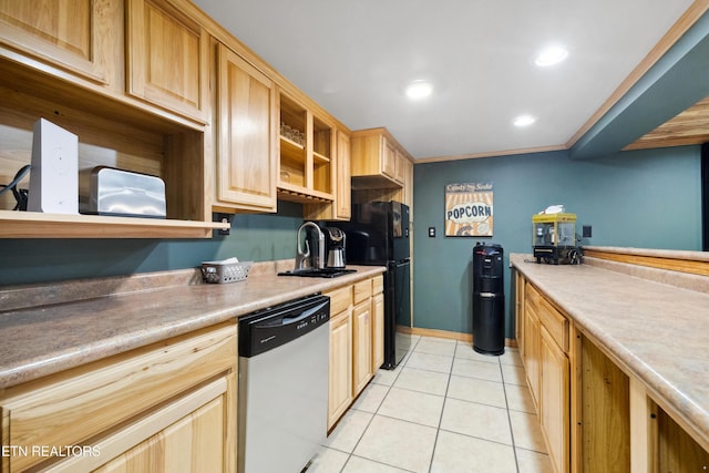 kitchen with black refrigerator, light tile patterned floors, light brown cabinetry, sink, and stainless steel dishwasher