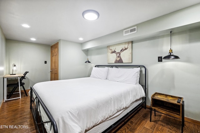 bedroom featuring dark hardwood / wood-style flooring