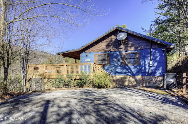 view of front of house with a wooden deck