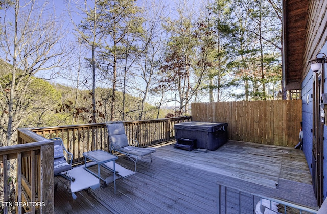 deck with a hot tub