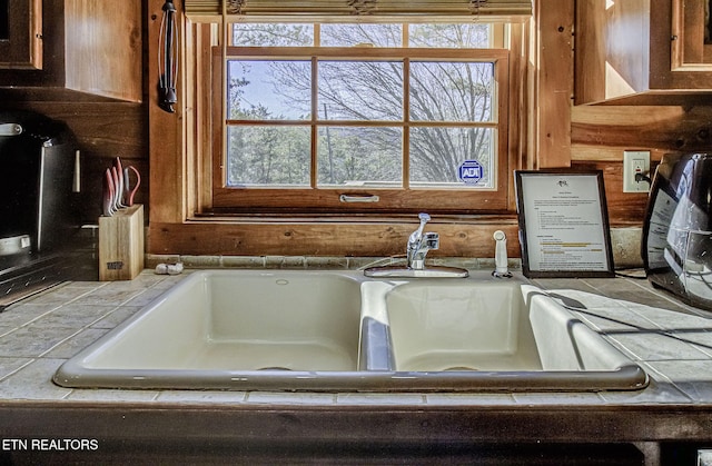 room details with tile countertops and sink