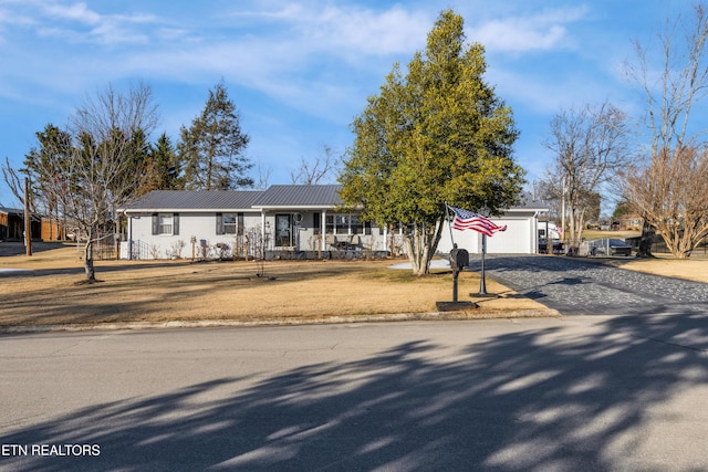 ranch-style house with a garage and a front yard