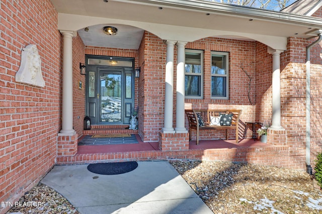 property entrance with covered porch