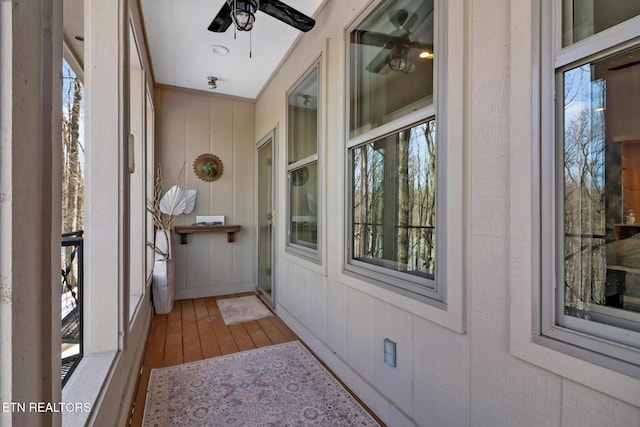 exterior space with ceiling fan