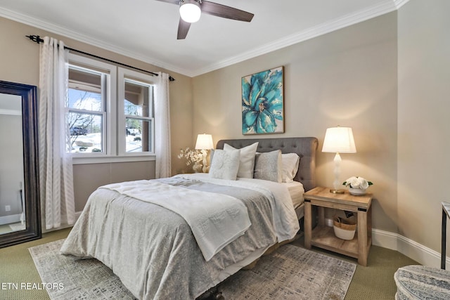 carpeted bedroom featuring crown molding and ceiling fan