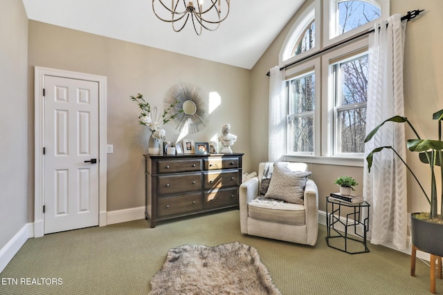 sitting room featuring an inviting chandelier, light colored carpet, and vaulted ceiling