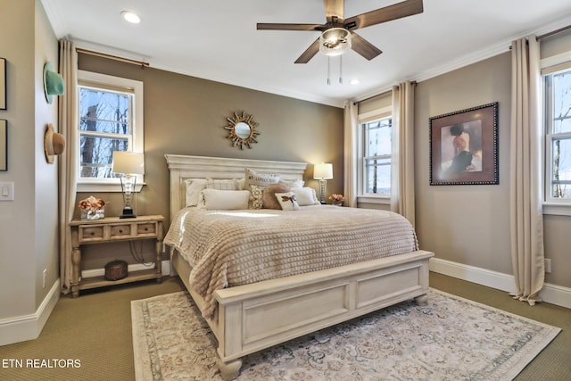 bedroom with crown molding, ceiling fan, and carpet