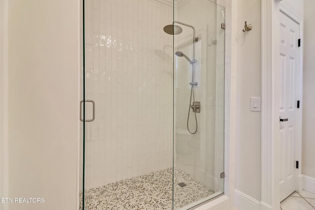 bathroom featuring walk in shower and tile patterned floors