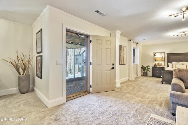 carpeted bedroom featuring crown molding and access to outside