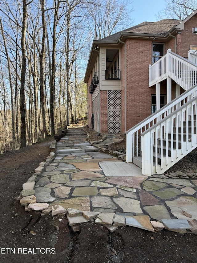 view of side of property with a patio area