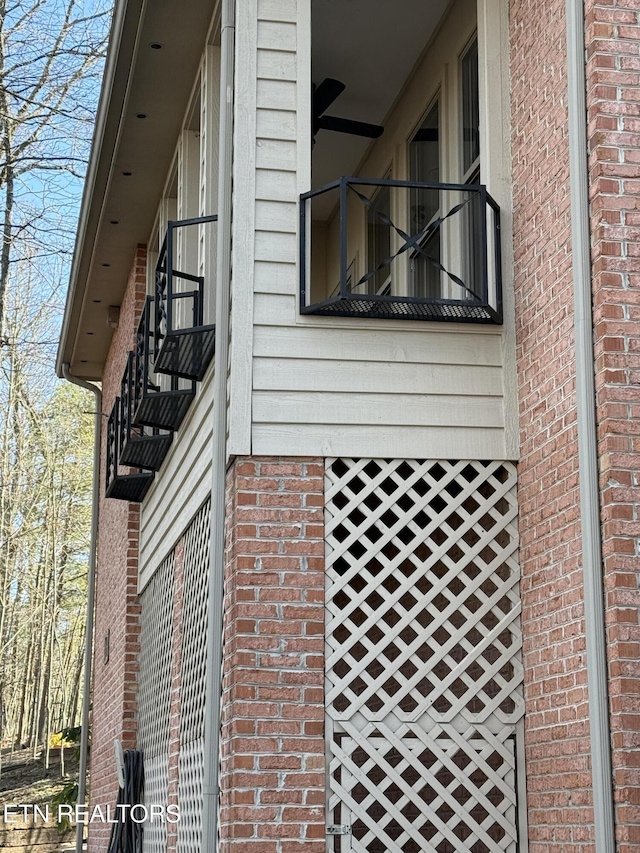 view of side of property featuring a balcony