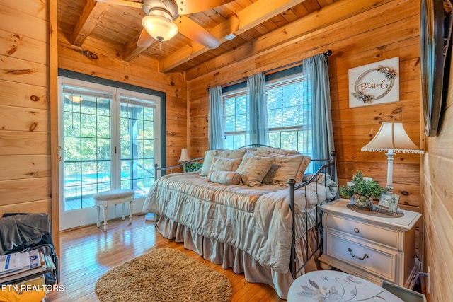 bedroom with wooden ceiling, ceiling fan, wooden walls, and beamed ceiling