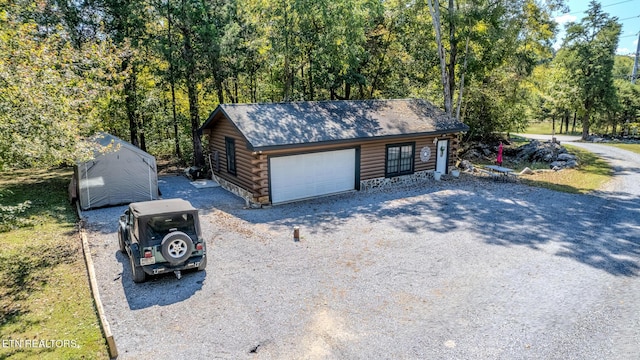 view of front facade with an outdoor structure and a garage