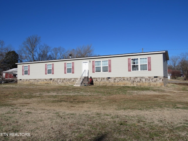 manufactured / mobile home featuring crawl space, a front lawn, and entry steps