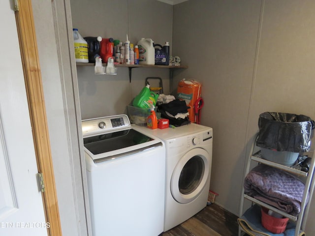 laundry area featuring laundry area, independent washer and dryer, and dark wood-style flooring