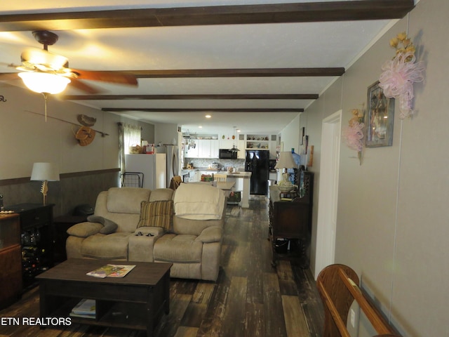 living room featuring beamed ceiling, dark wood-style floors, and a ceiling fan