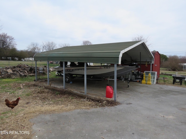 view of parking / parking lot featuring a carport