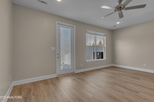 spare room featuring ceiling fan and light hardwood / wood-style floors