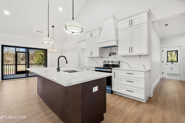 kitchen with decorative light fixtures, custom range hood, decorative backsplash, electric range, and white cabinetry