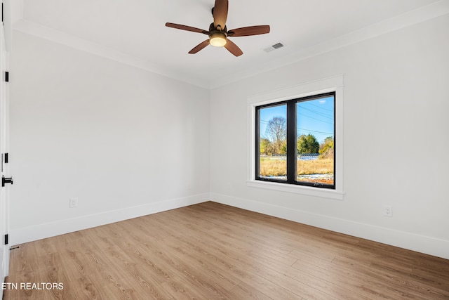 unfurnished room featuring crown molding, ceiling fan, and light hardwood / wood-style flooring