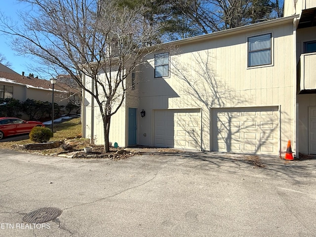 view of property exterior with a garage