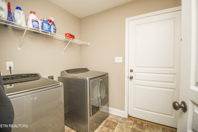 washroom featuring washer and dryer