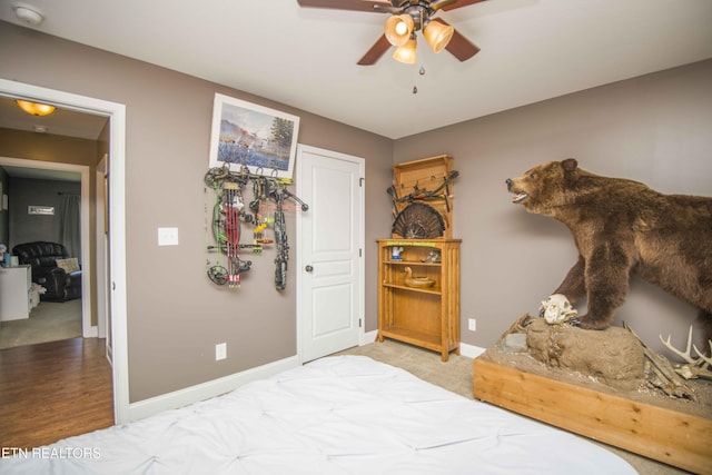 bedroom with light colored carpet and ceiling fan