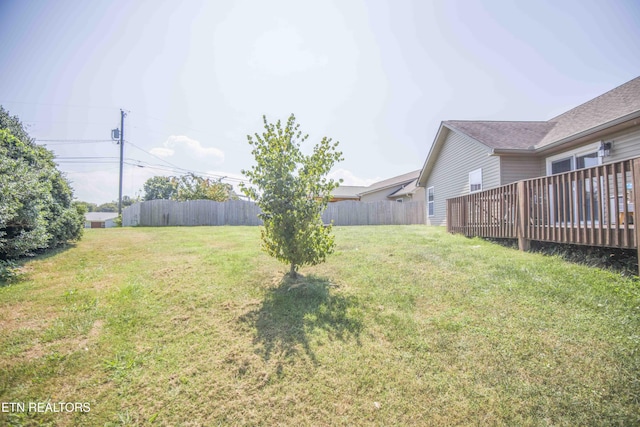 view of yard featuring a wooden deck