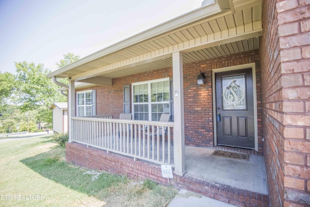 property entrance with a porch